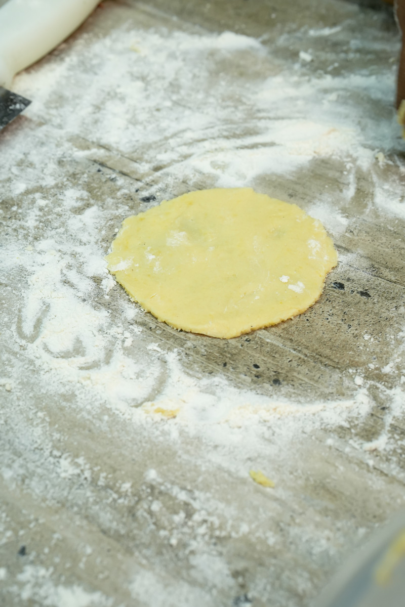Rolling out pineapple bun cookie topping dough
