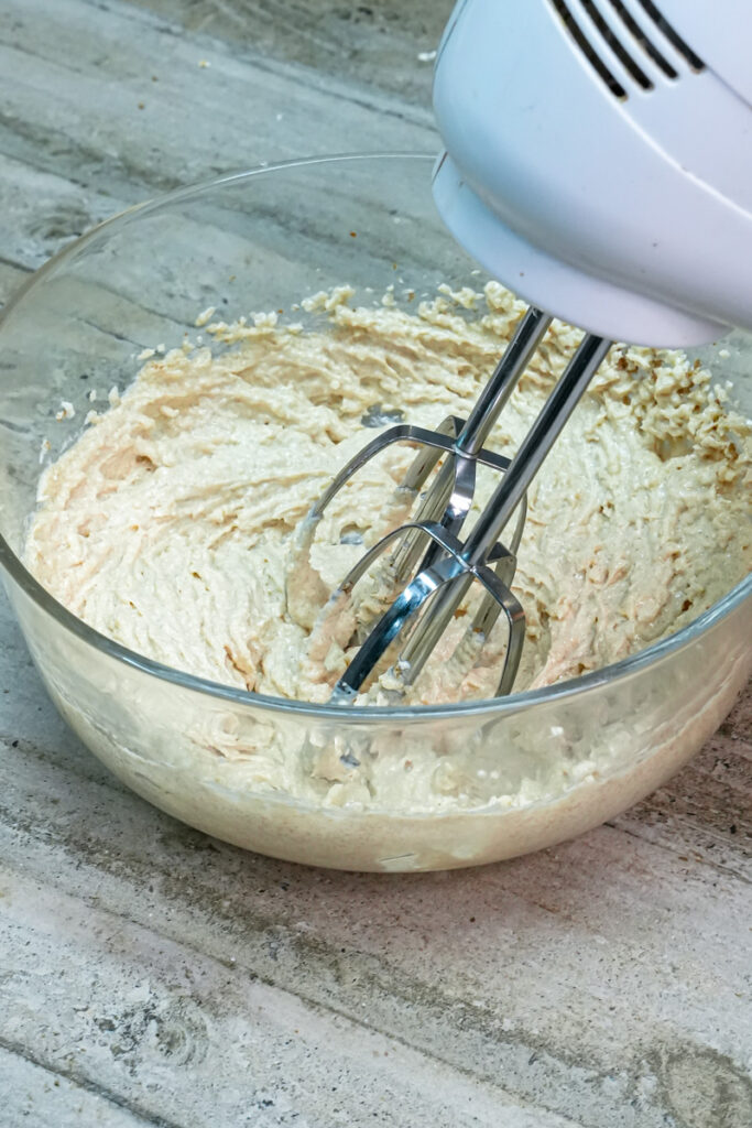 Smooth creamed butter and sugar mixture in bowl