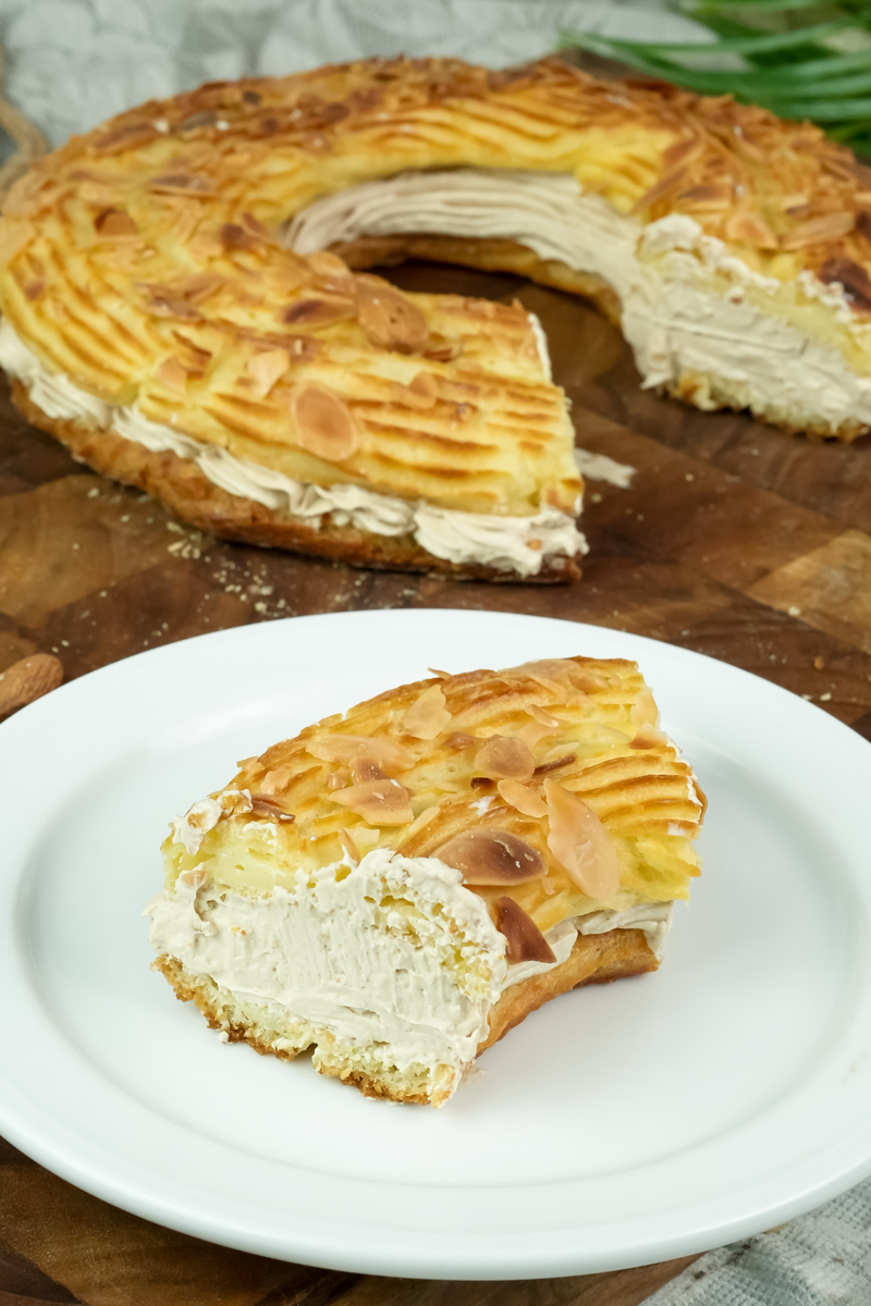 Traditional Paris Brest dessert with almond slices and cream filling slice