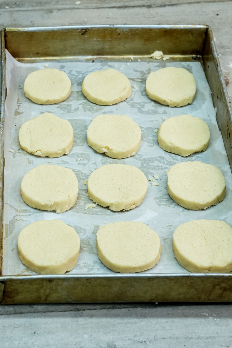 Unbaked Twix cookies on baking tray before oven