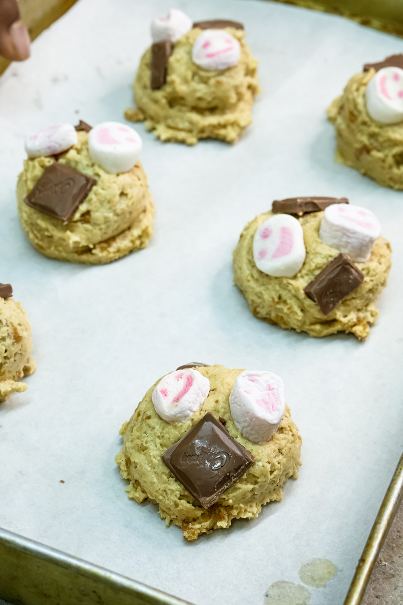 S'mores cookies with marshmallows and chocolate on baking tray