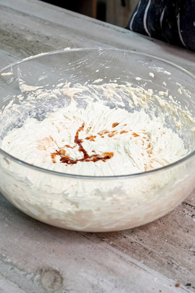Vanilla extract being mixed into cookie dough