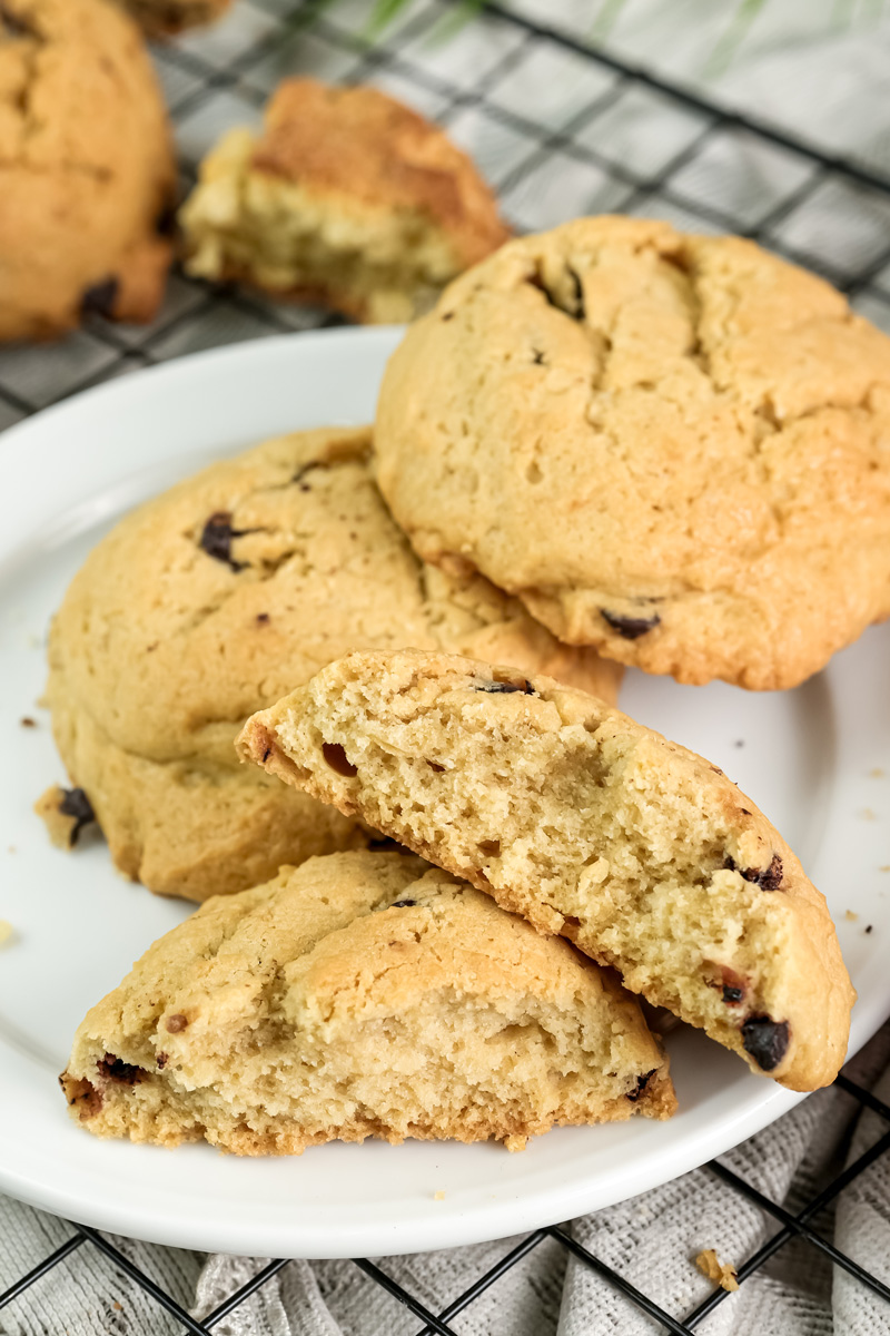 A close-up of a cookie broken in half to show its soft, chewy interior