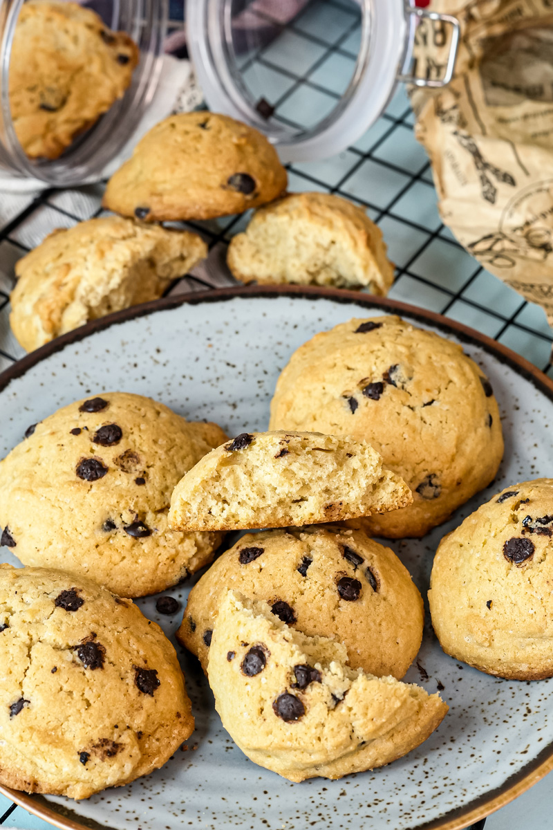 A chocolate chip cookie broken in half to show the soft inside