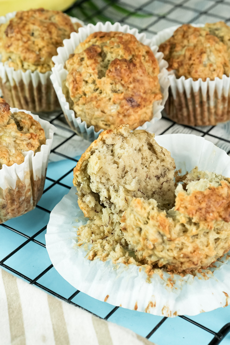 Close-up of a halved banana protein muffin showing its soft, fluffy interior