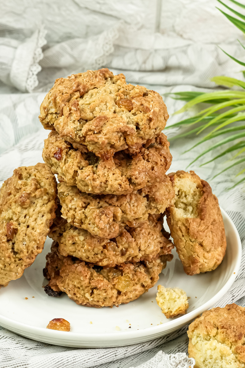 Stack of oatmeal raisin cookies on white serving plate