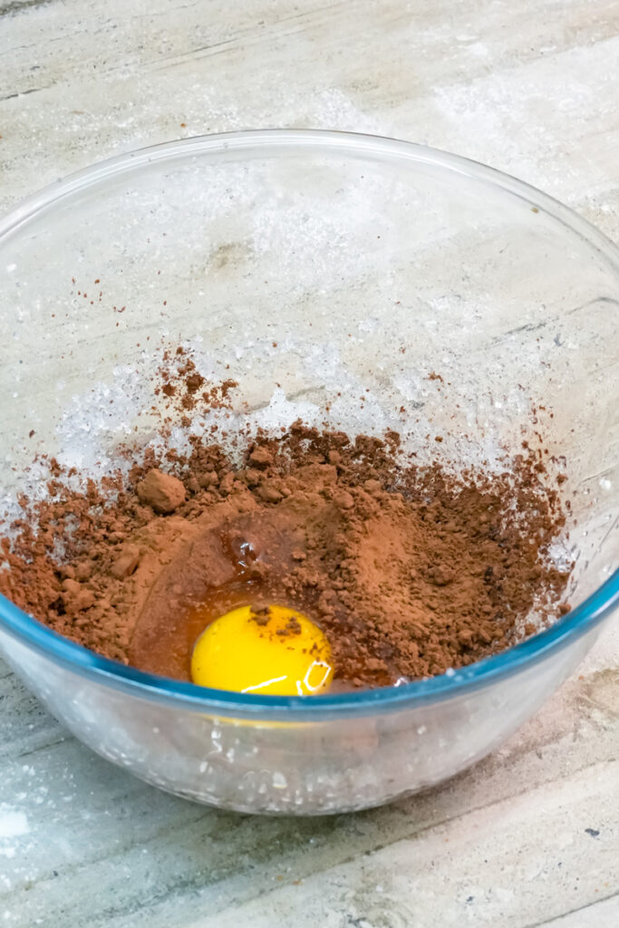 A single egg yolk is added to the cocoa mixture.