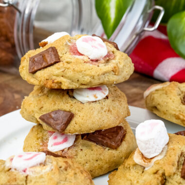 Stack of s'mores cookies with melted marshmallows and chocolate