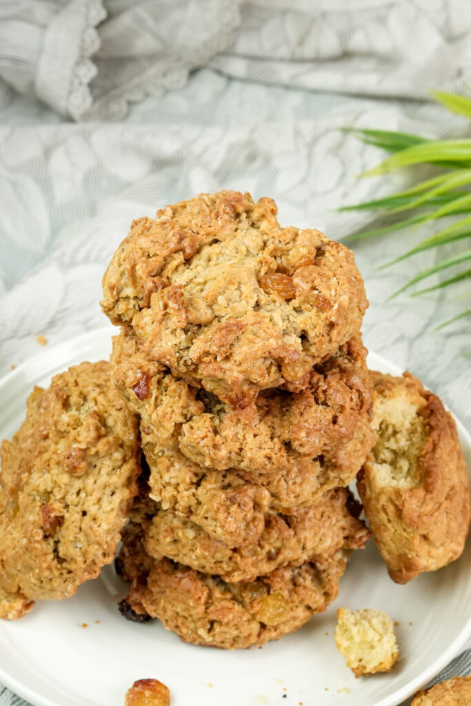 Close-up stack of golden oatmeal raisin cookies with raisins visible
