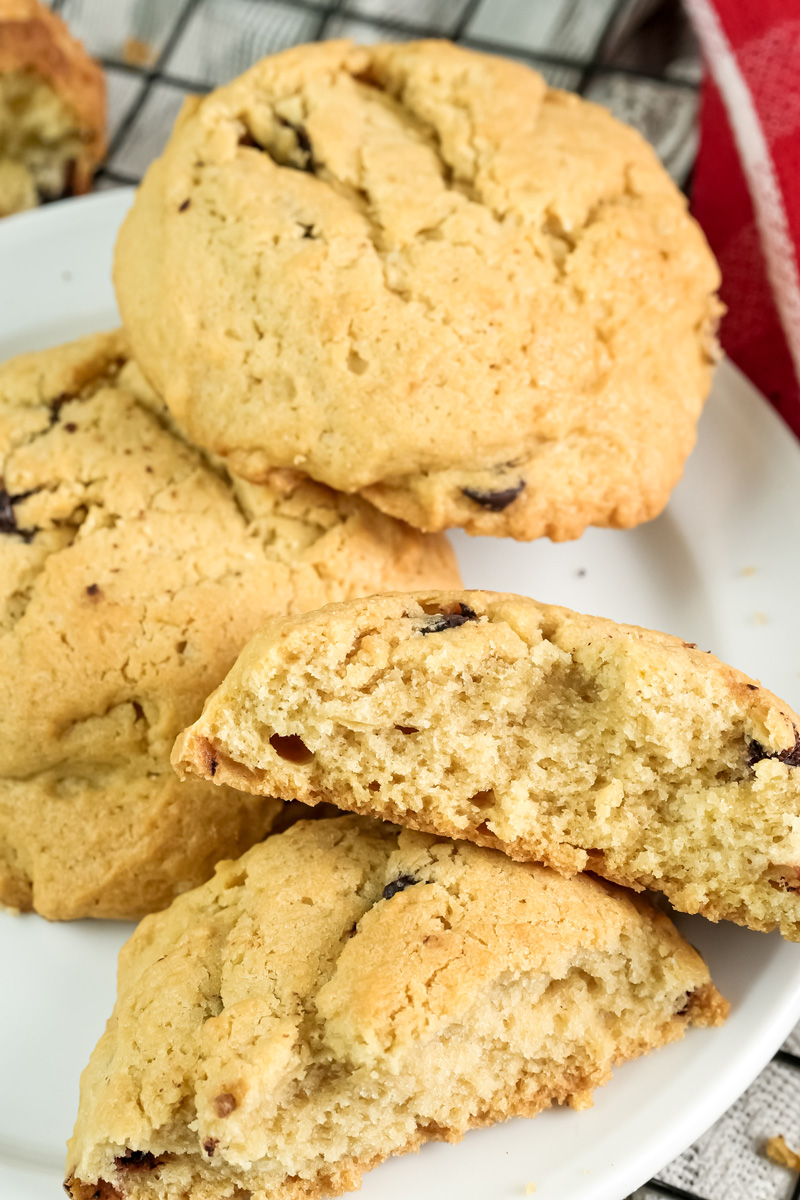 A detailed view of a broken cookie, highlighting the inside texture and chocolate chips