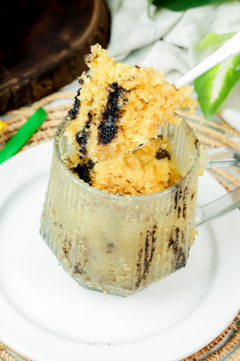 A spoonful of fluffy peanut butter cake with dark chocolate