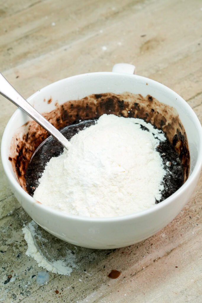 Adding dry flour mixture to the chocolate liquid base