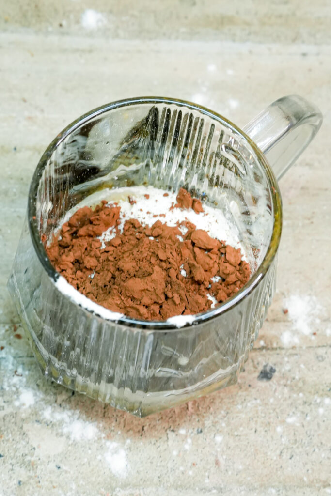 Adding unsweetened cocoa powder to the mug cake mix