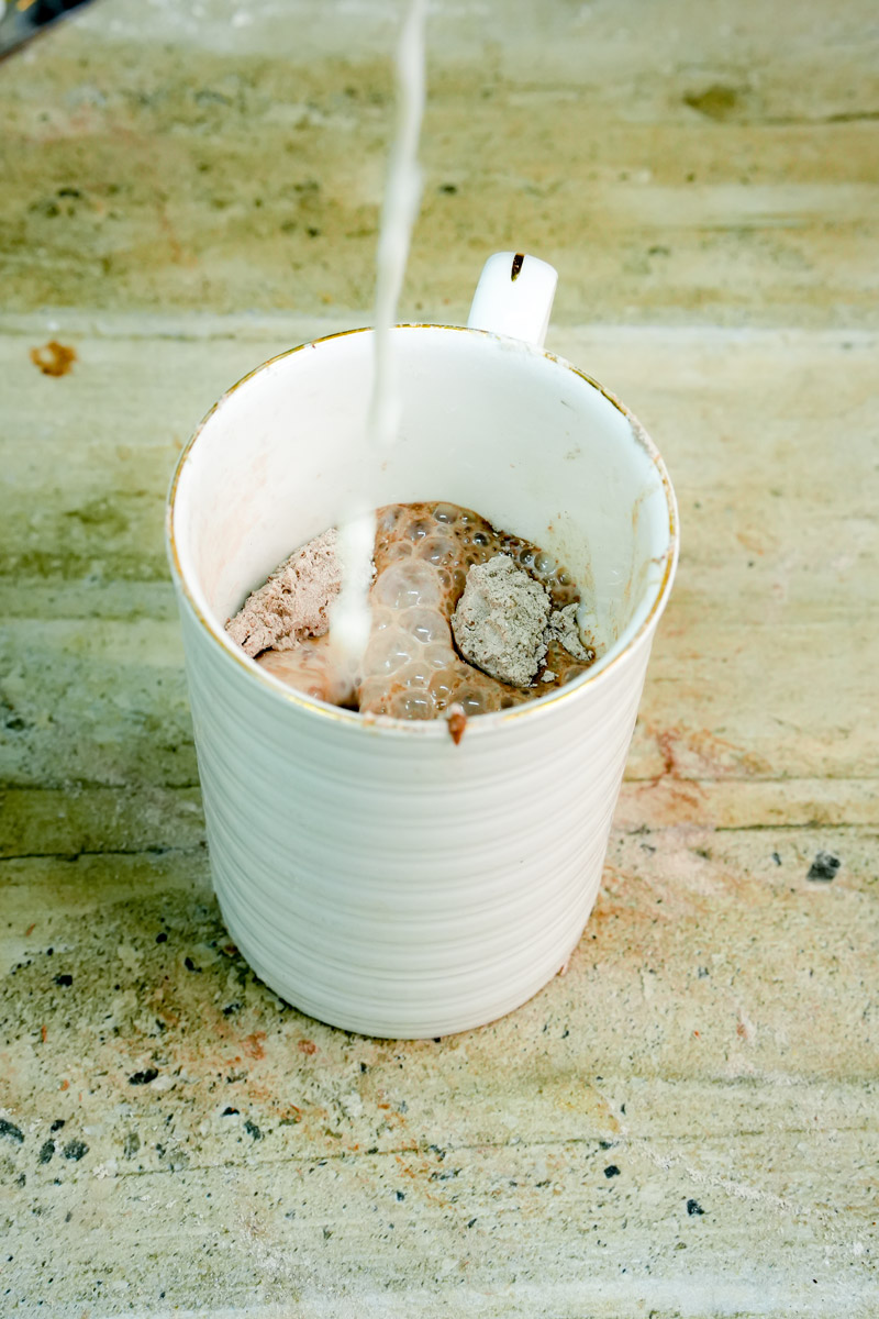 Adding wet ingredients to the chocolate protein batter