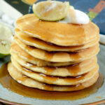 Delicious lemon breakfast pancakes ready to serve on a rustic plate