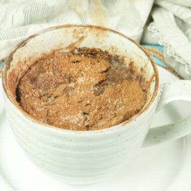 Homemade snickerdoodle mug cake with a crunchy cinnamon sugar topping