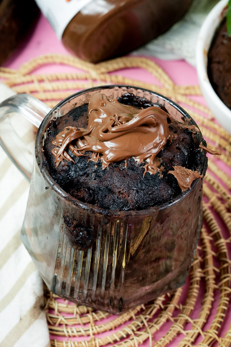 Keto chocolate mug cake topped with a dollop of hazelnut spread
