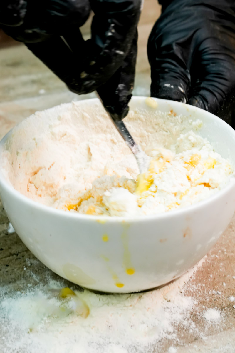 Mixing dry flour into the wet banana mug cake ingredients