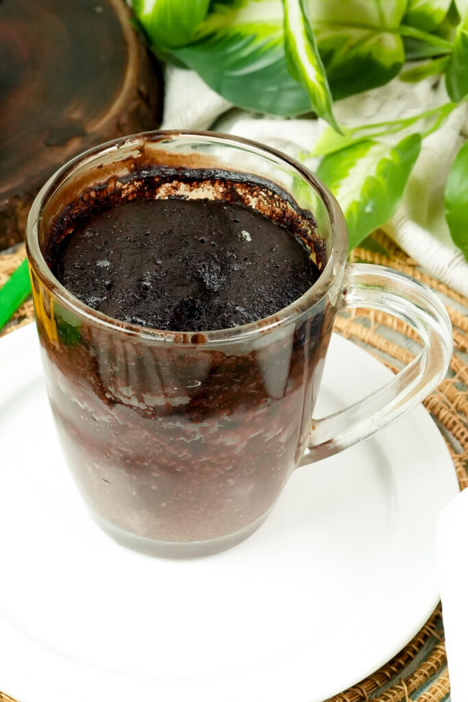 Moist gluten-free chocolate mug cake served on a white plate