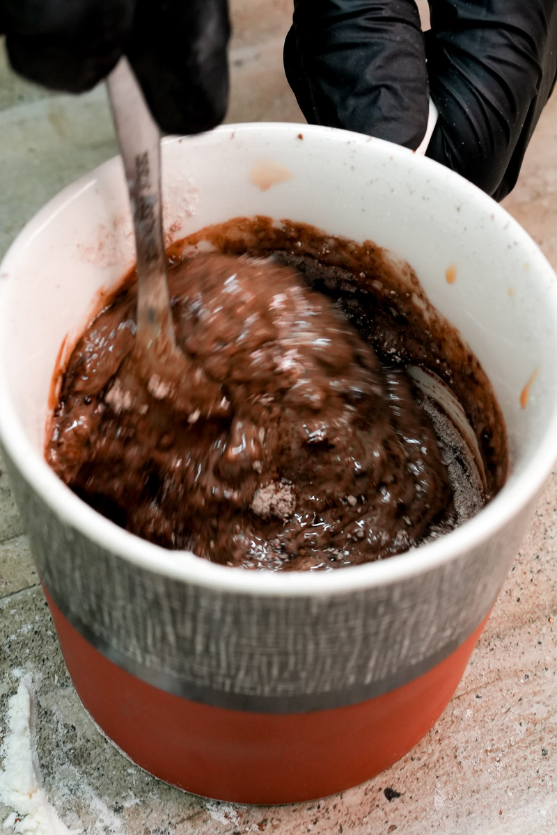 Stirring chocolate mug cake batter until smooth