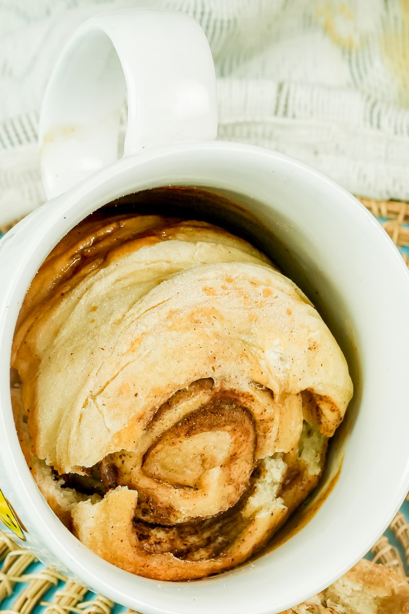 Top-down view of a perfectly cooked 2-minute cinnamon roll in a mug