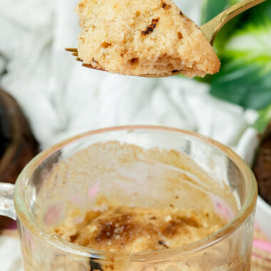 Close-up of the crumb texture of a microwave coffee mug cake on a gold fork