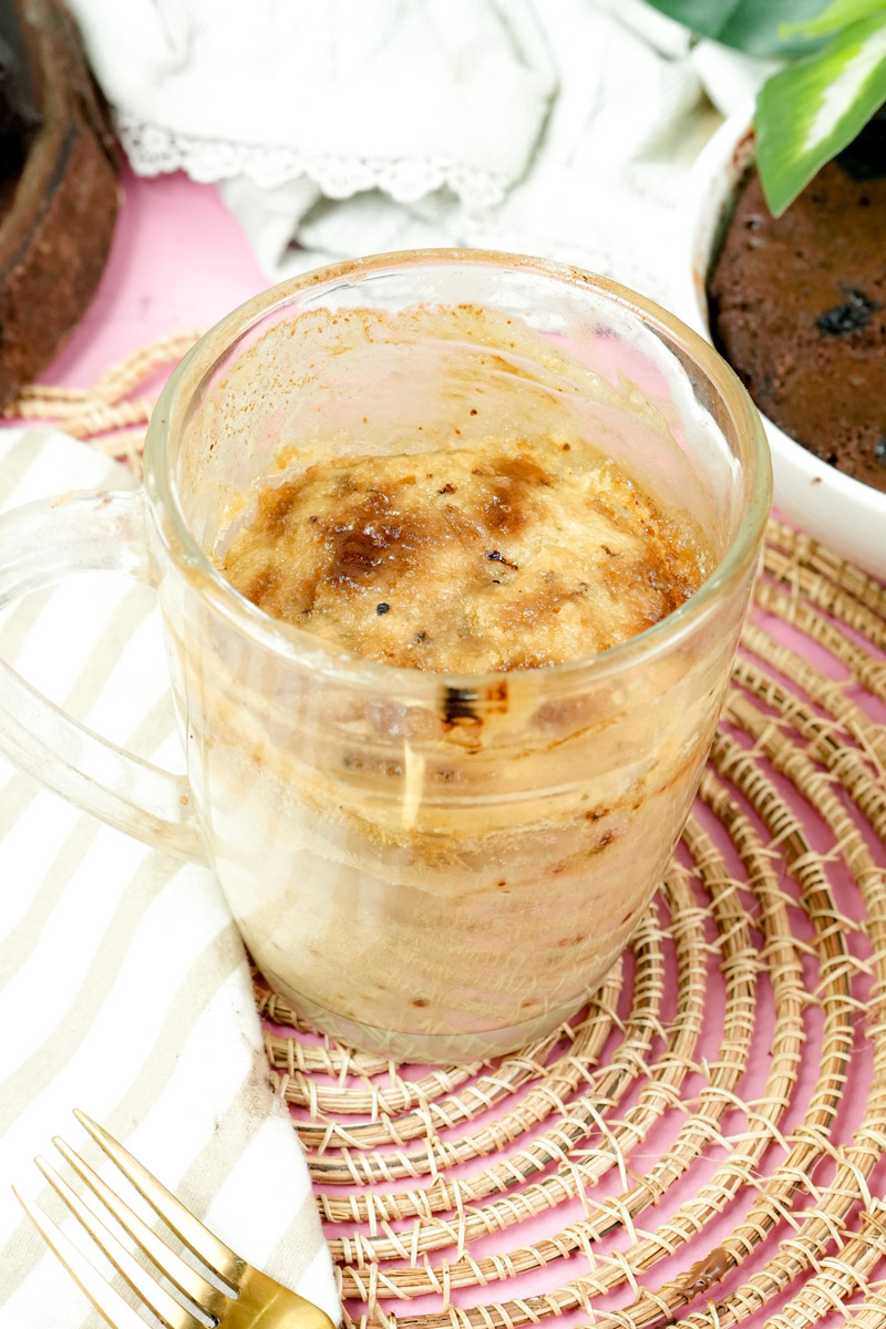 Side view of a fluffy microwave coffee cake with a golden brown top