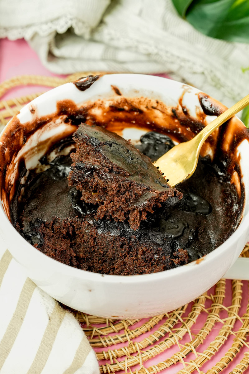 Taking a forkful of warm, moist eggless chocolate mug cake