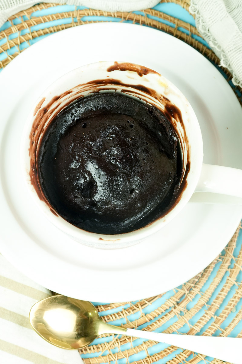 Overhead view of a freshly baked, moist vegan chocolate mug cake