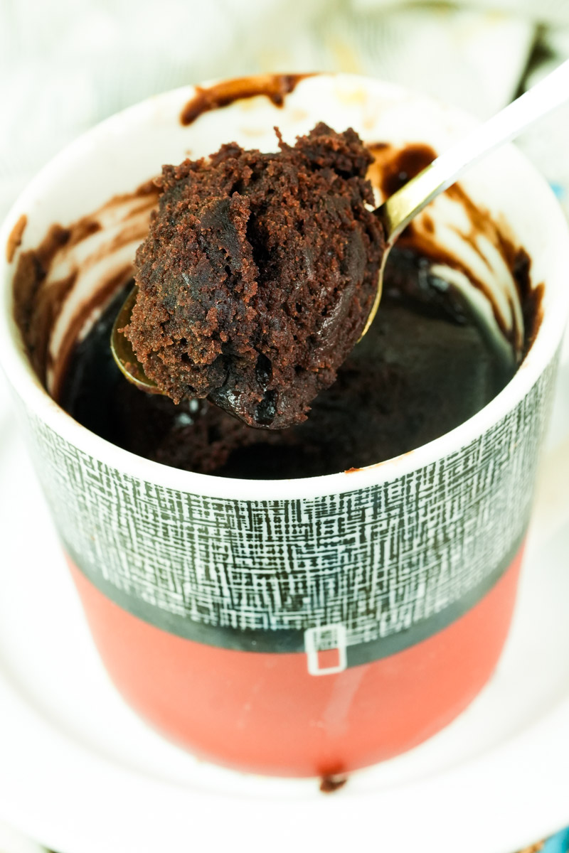 Detail shot of the soft, fudgy texture of a vegan chocolate mug cake