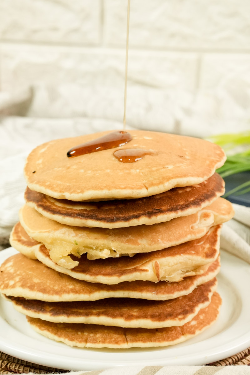 Homemade American style pancakes stacked high for breakfast.