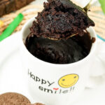 Showing the soft, moist crumb of a homemade Oreo mug cake on a spoon