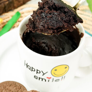 Showing the soft, moist crumb of a homemade Oreo mug cake on a spoon