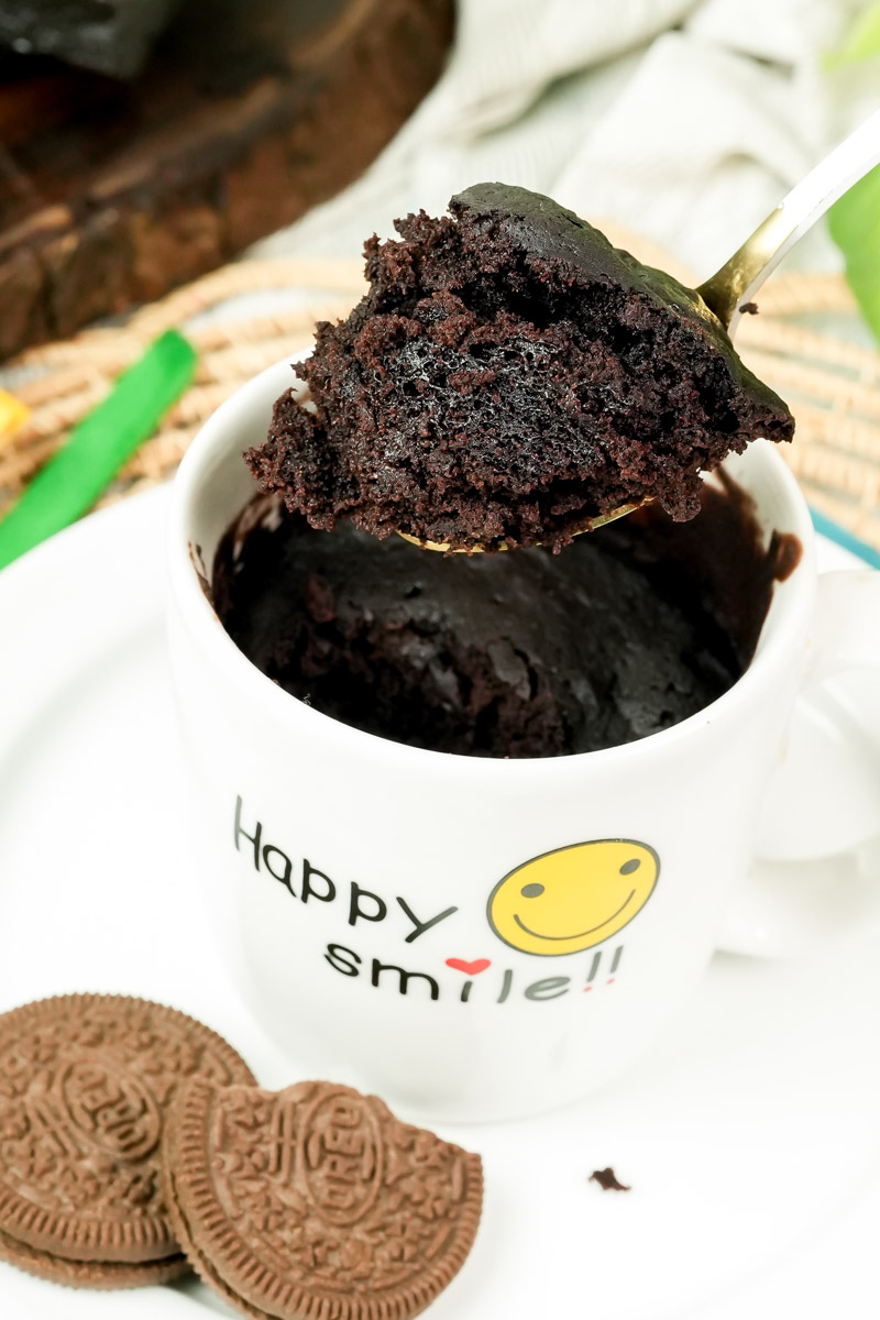 Showing the soft, moist crumb of a homemade Oreo mug cake on a spoon