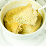 Close-up of the interior texture of a microwave banana mug cake on a spoon