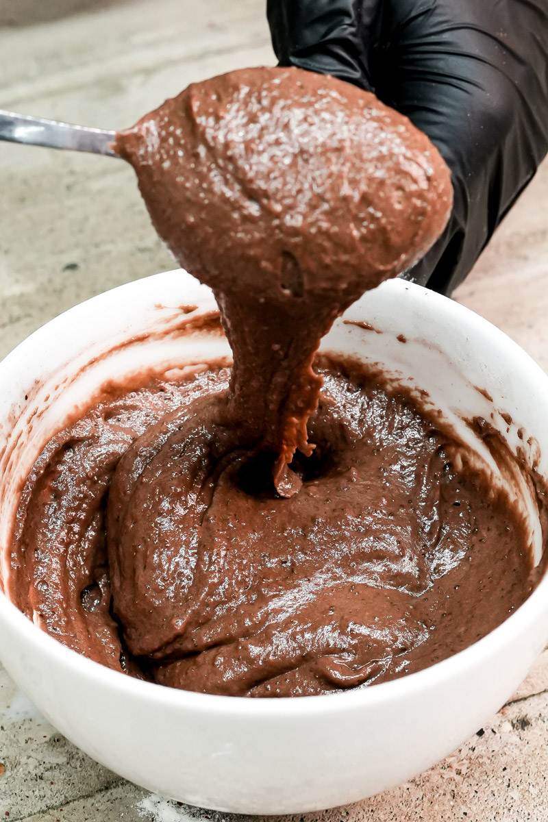 Showing the perfect thick consistency of healthy chocolate mug cake batter