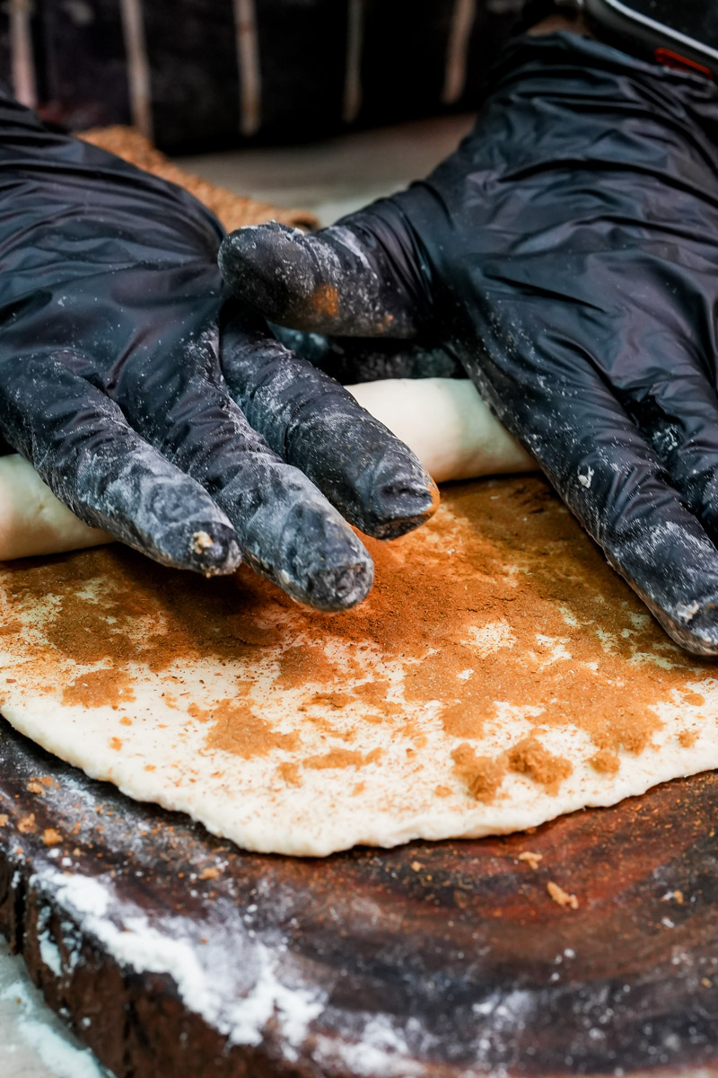 Tightly rolling the dough into a spiral shape for the mug cake